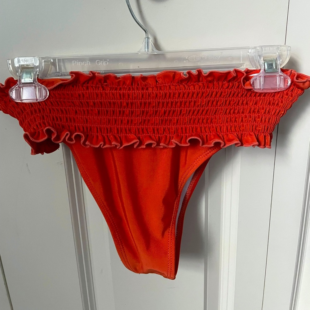 Orange/Red bathing suit bottoms.